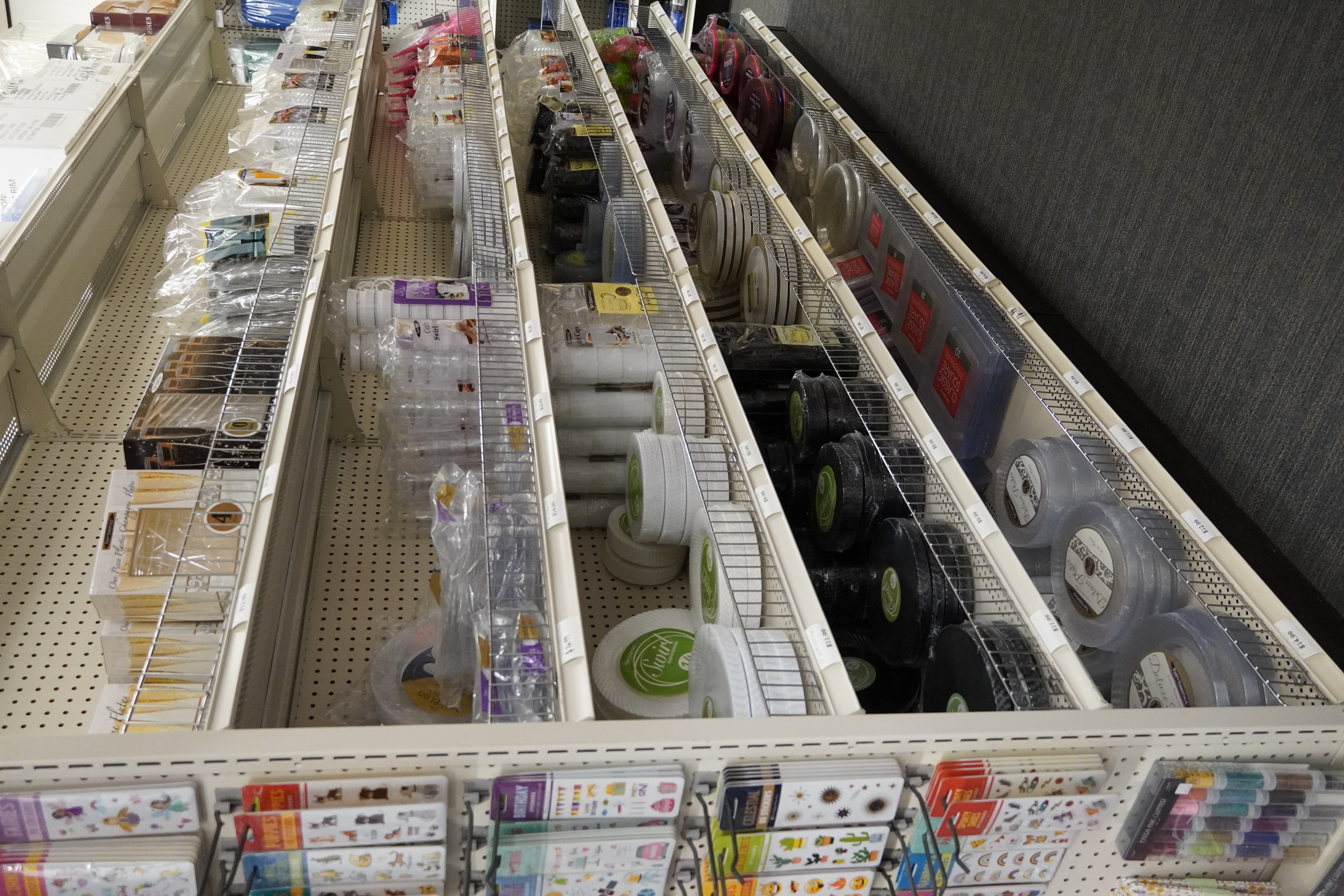 Birthday and themed party supply aisle stocked with banners, plates, and decorations.