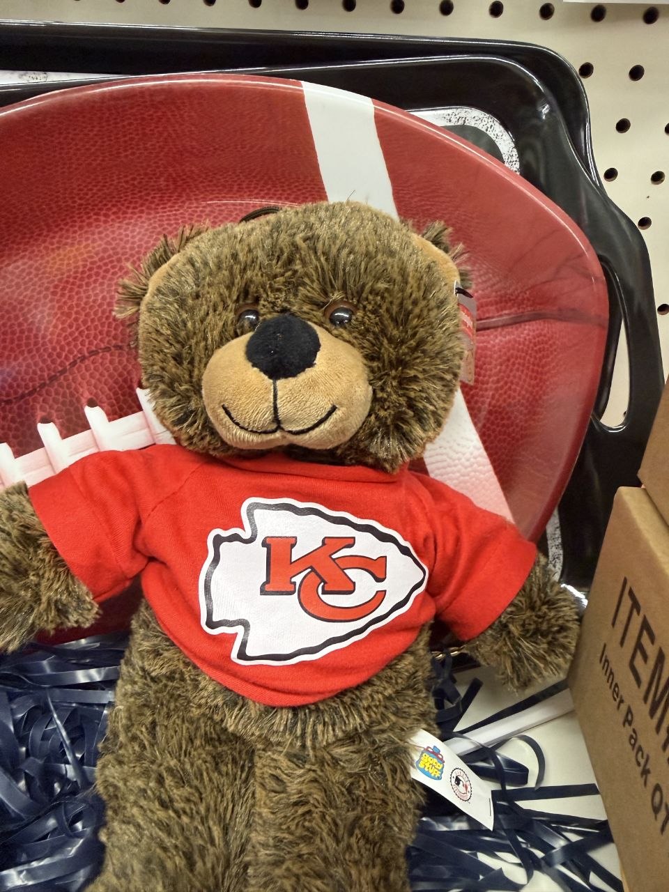 Kansas City Chiefs teddy bear in a red shirt with a football party tray.