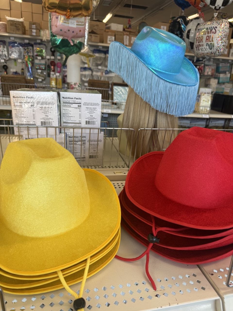 Red, yellow, and blue cowboy hats for football party outfits.