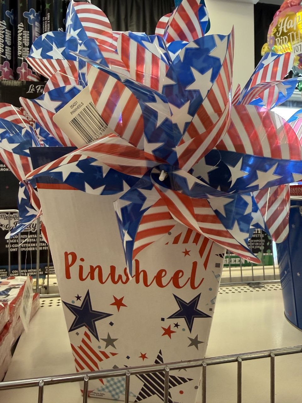 Red, white, and blue star-patterned pinwheels in a party display.