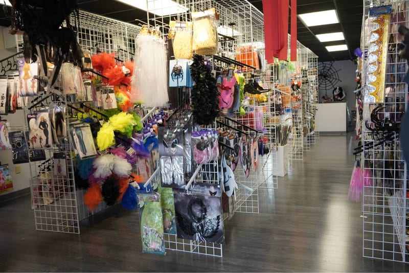 Halloween costume displays and props in the upstairs Spookier section.